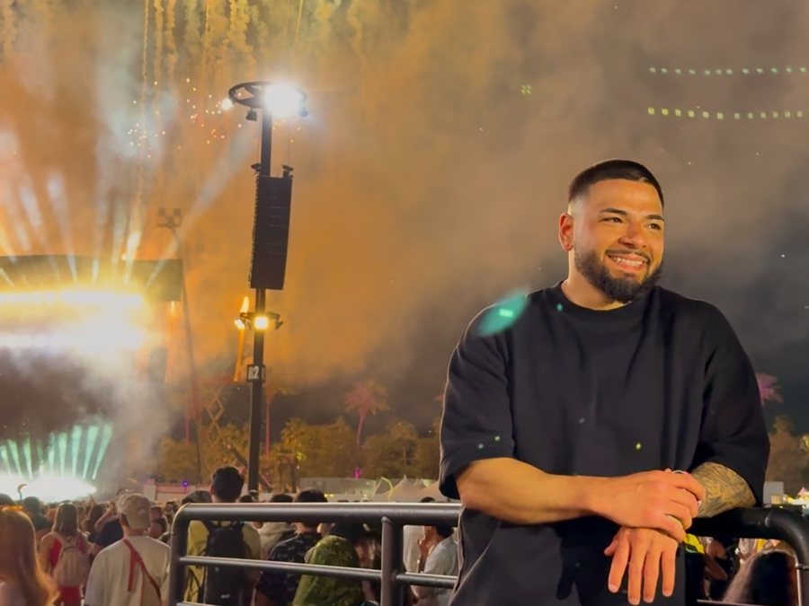 Lagundo at a festival as fireworks fill the sky behind him
